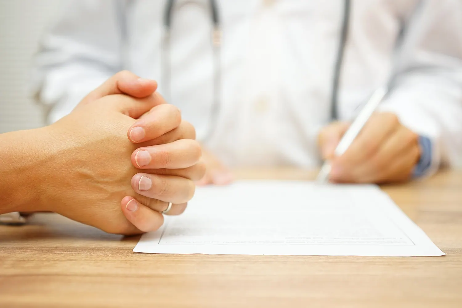 Chiropractor reviewing a report of findings with a patient
