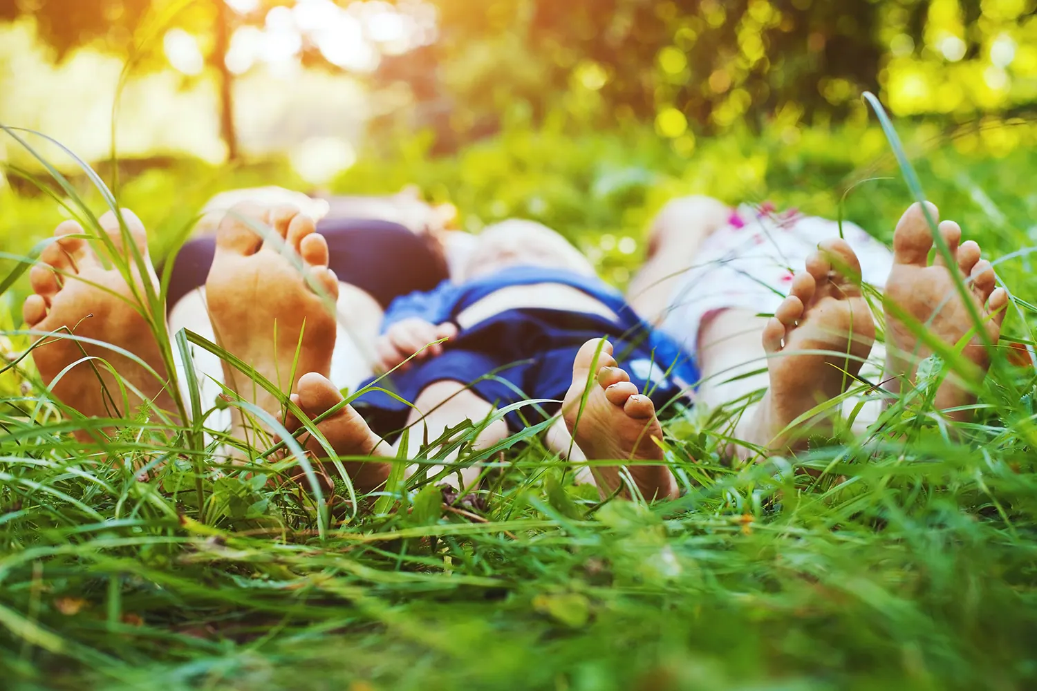 Couple relaxing on the grass, enjoying good health